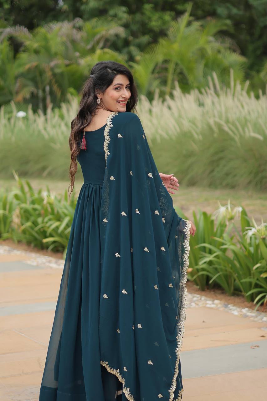 Graceful Aqua Blue Color Embroidered Work Kalamkari Border Gown