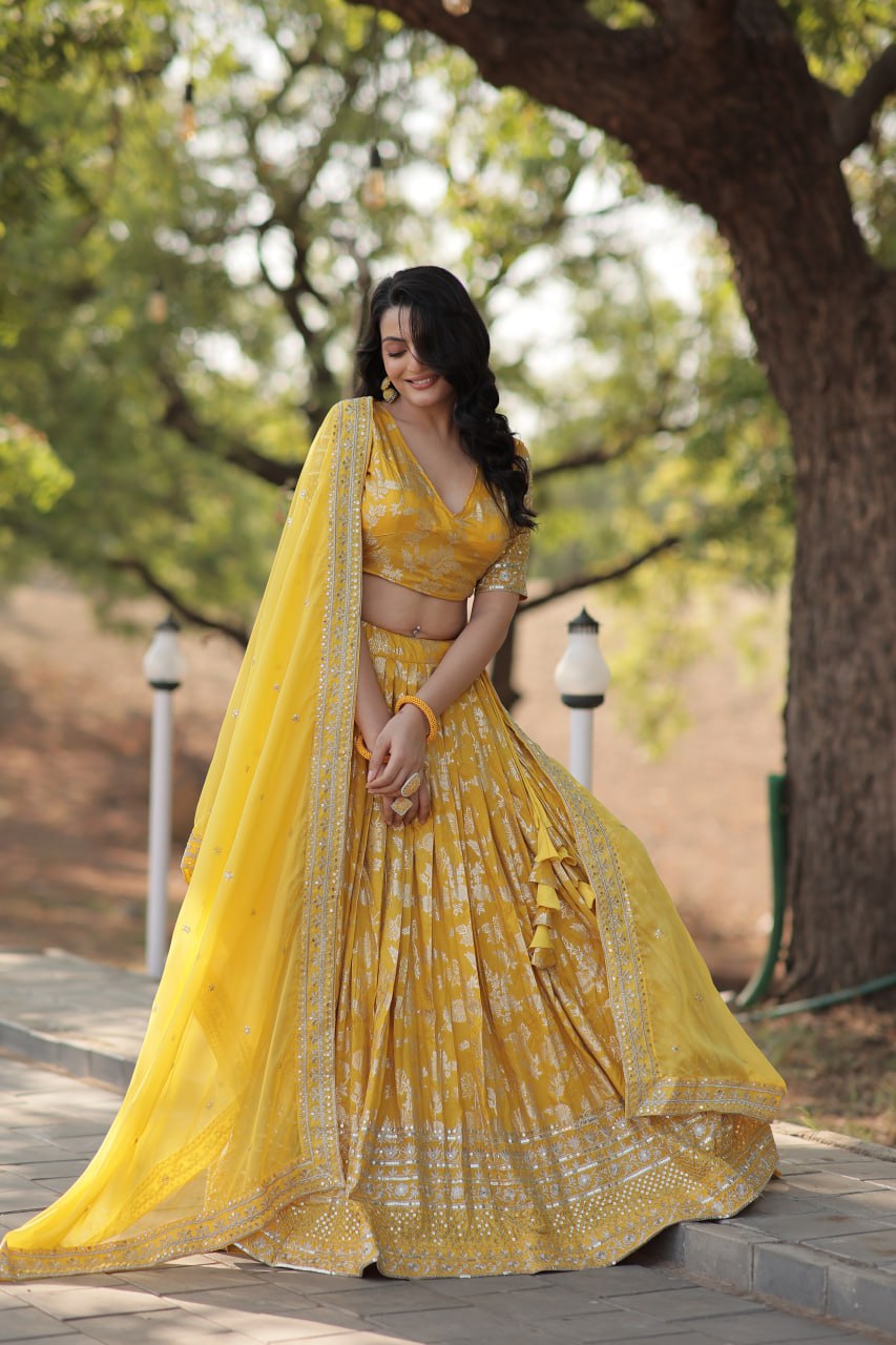 Weeding Wear Yellow And Maroon Color Jacquard Sequence Work Lehenga Choli